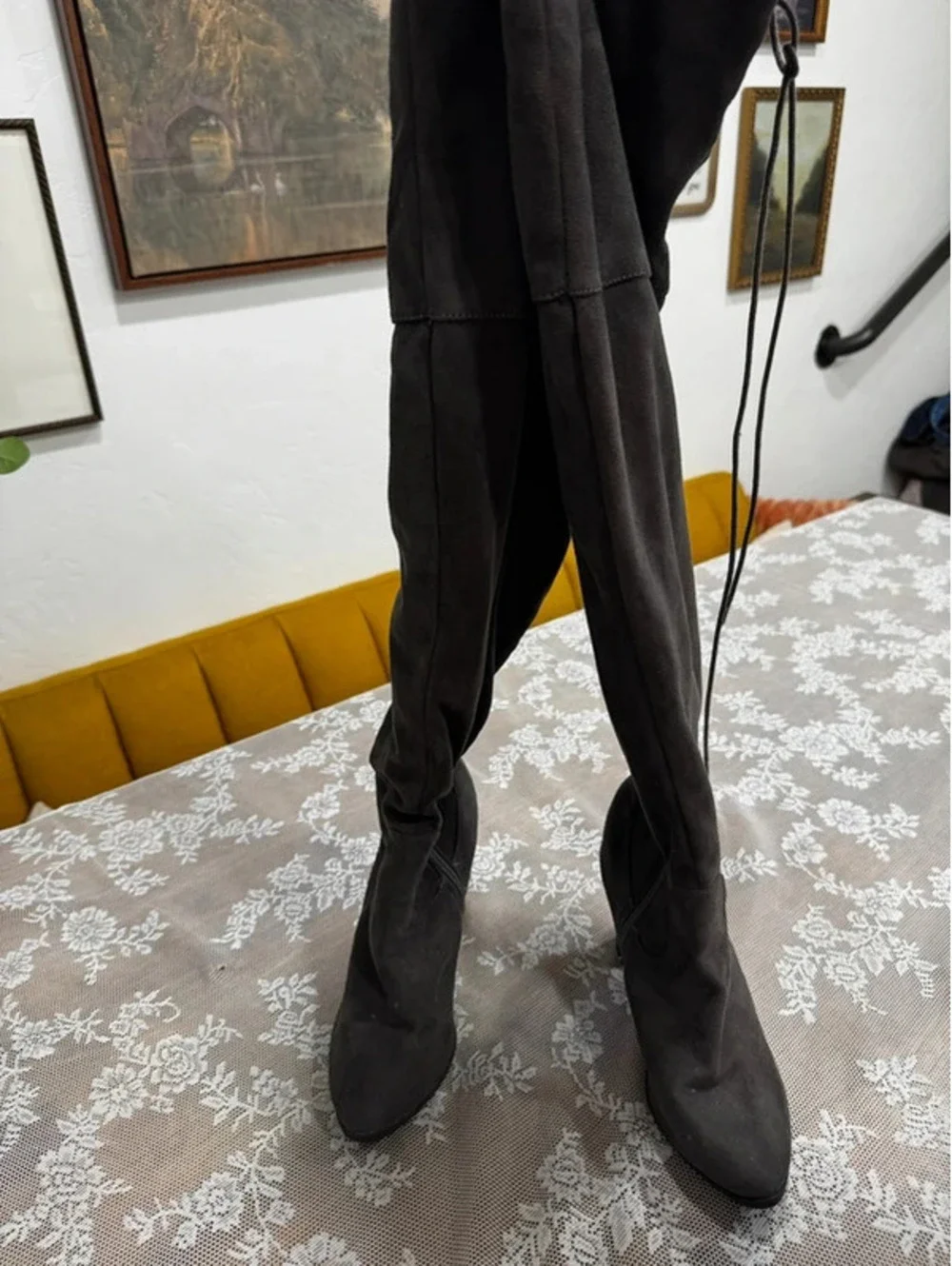 gray knee height boots with back tie